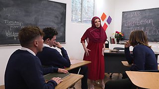 Hot teacher Kiki Daire fucks students in a steamy scene.