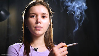 18 Aged Girl Is Smoking Two Strong Cork Cigarettes