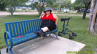 Nurse Vicki Smoking in the Park on a Bench All Dressed up