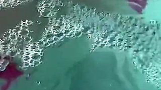 Artemisia Love Sexy and Horny Underwater Showing Her Big Tits in a Super Micro Bikini and You Can See Her Aureolas…