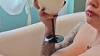 Two Busty MILFs Play with Each Other and Pour Milk Over Each Other's Bodies in the Bathtub.