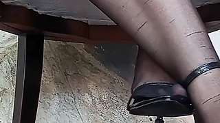 In Front of You the Secretary with Pantyhose and Stiletto Heels Dangling From Her Feet