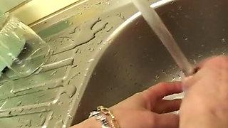 Masturbation in the kitchen for the mature slut