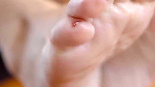 Mature Blonde MILF Soaks Her Feet in Piss