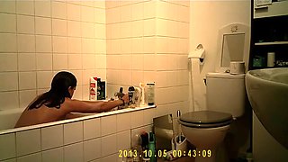 Brunette uses the toilet and takes a shower