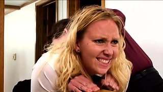 Femdom mistress spanking a blonde restrained sub