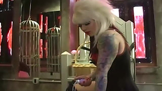 Tattooed Latex Mistress Dominates Her Collared Male Slave