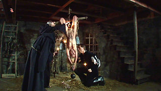 Witch Hangs Upside Down and Gets Drizzled with Black Wax