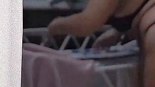 A Shameless Housewife Showing off to Passersby on the Street While Her Husband Is at Work