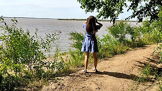 I Lift up My Dress and Show My Butt on the Riverbank
