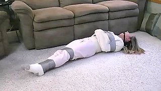 Jennifer straitjacketed, ball gagged, and duct taped