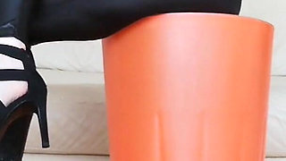 Raven Toe Tapping Crossed Legs with Hight Hells and Latex Pants