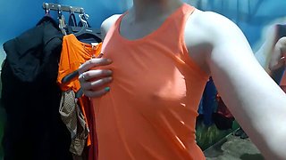 Brunette teen masturbates in a public fitting room.