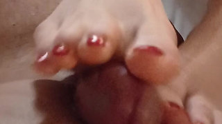 Kelly Performs a Technical Footjob Bringing Dominik's Cock to a Squirting Orgasm.