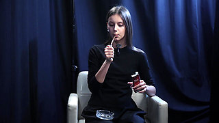 Young Girl Smoking Solo in a Calm Studio Session with Slow Exhales