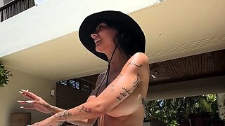 Big tittied Latina MILF housewife sunbathing by the pool