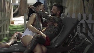 Asian beauty Katana gives a blowjob to a hung tattooed guy before outdoor action
