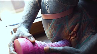 Gorgeous tattooed girl fucks her ass with a big dildo