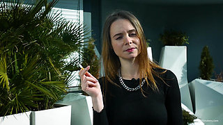 Young Russian Girl Smoking Cigarette by Seaside