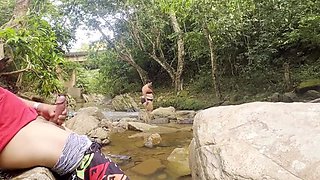Unknown girl gives me a handjob in the river and cums on her big tits