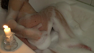 A Slender Beauty Takes a Bath with Foam Caressing Pussy. Annahomemix