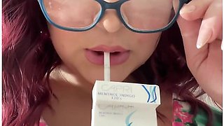 Sweet secretary smoking, alluring and teasing