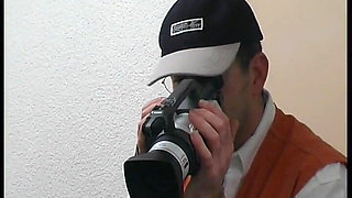 A cameraman lets go of his shoot to get his shot.