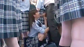 She gives him a blowjob on the bus and then fucks him while standing facing him.