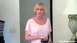 Blonde grandma is tugging and sucking cock in POV