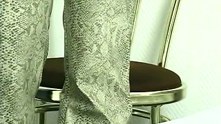 Sexy blonde babe is filling her snatch with a huge dildo