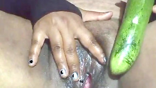 Today, Indian bhabhi quenched her desire by inserting a cucumber into her pussy.