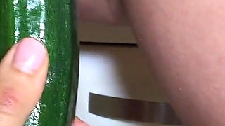 Naughty Brunette Beauty Nataly Gold Licks Cucumber and Puts Condom on It to Have Some Kitchen Fun