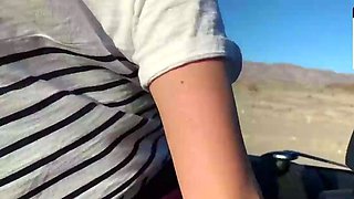 Blonde young adult with enormous tits in a car