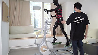 Mz27 - a Girl Bound in Latex Walks on a Treadmill